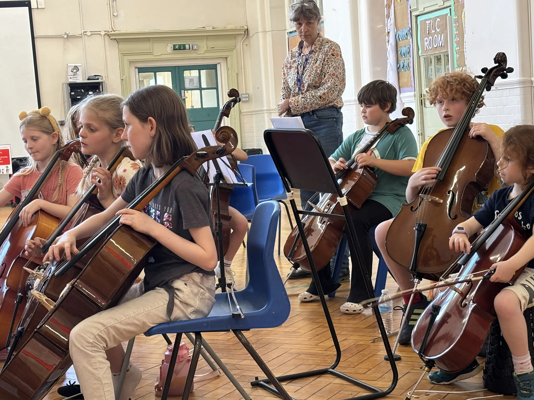 Young string players making music together